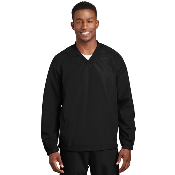 Sport-Tek V-Neck Raglan Wind Shirt.